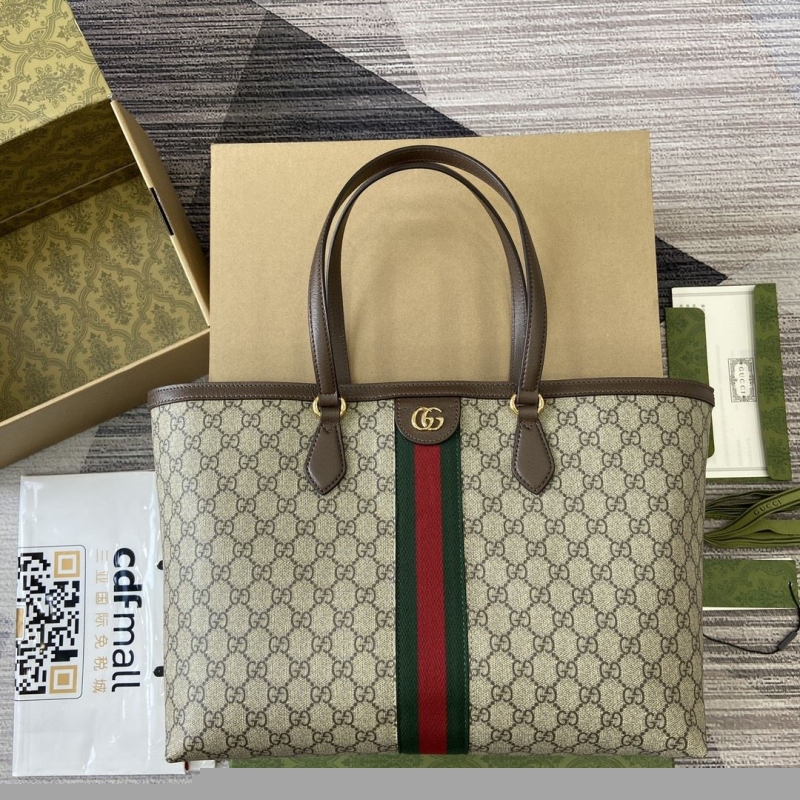 G*u*i shopping bags